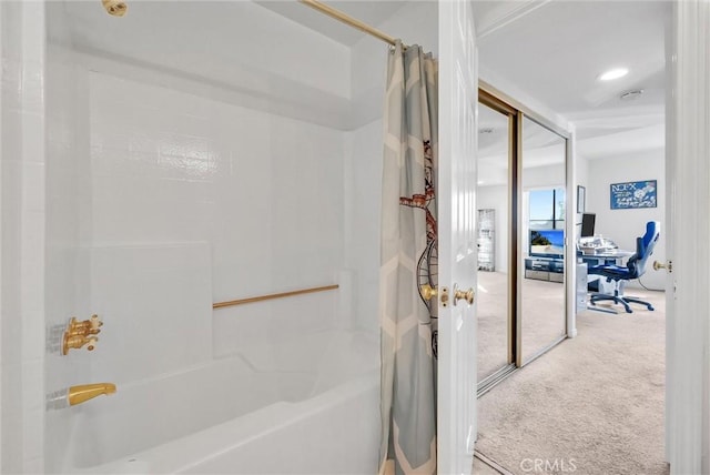 bathroom with shower / bath combo with shower curtain