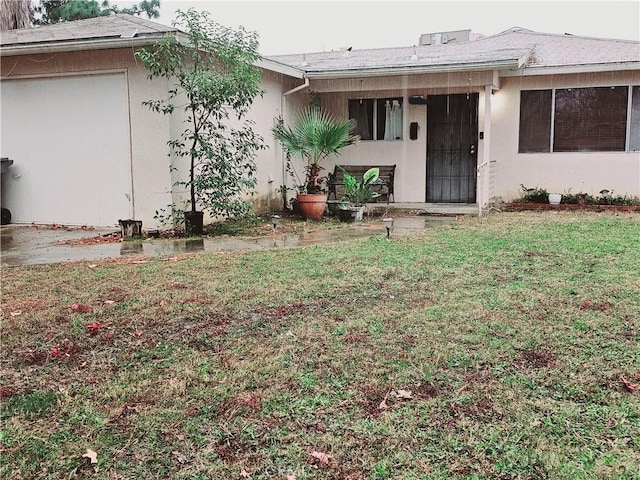 rear view of property with a yard