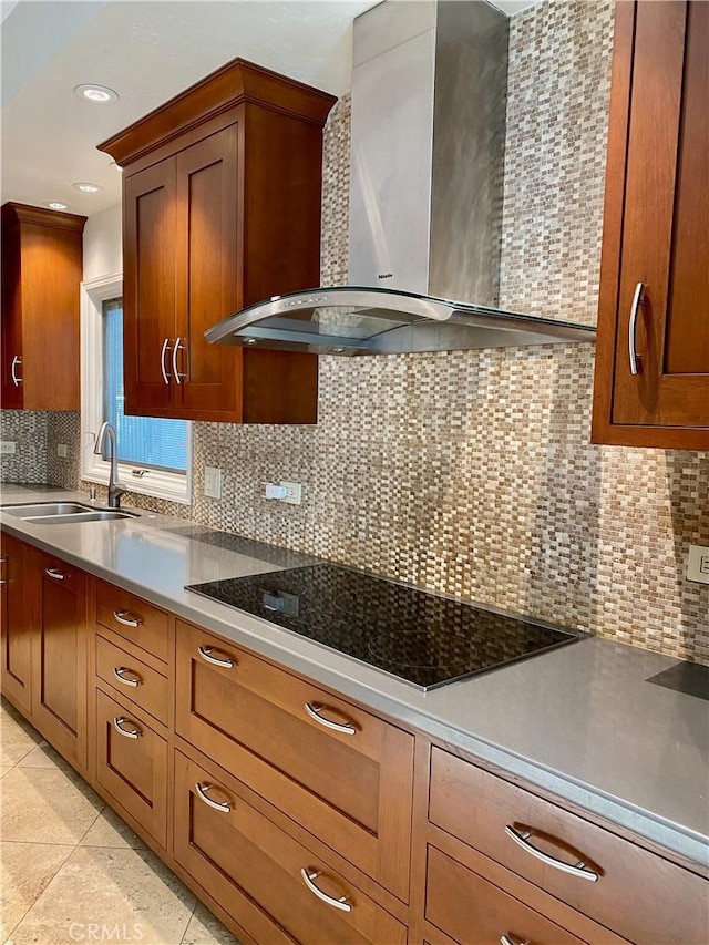 kitchen with backsplash, wall chimney range hood, sink, light tile patterned floors, and black electric cooktop