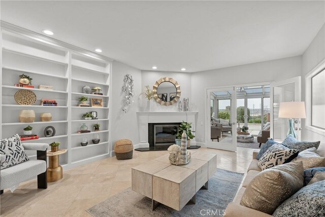 tiled living room featuring built in shelves