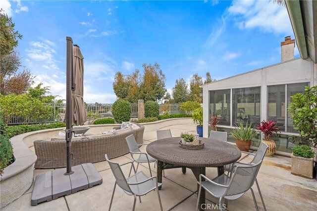 view of patio / terrace with a sunroom