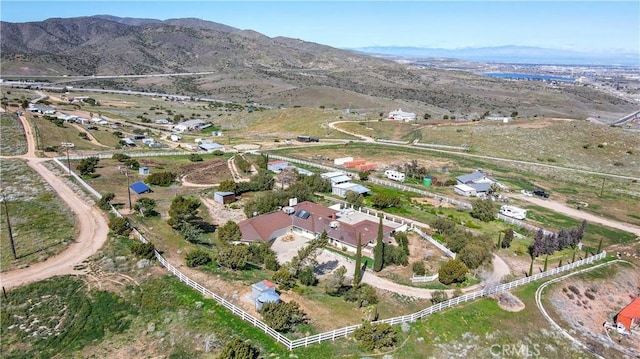 birds eye view of property with a mountain view