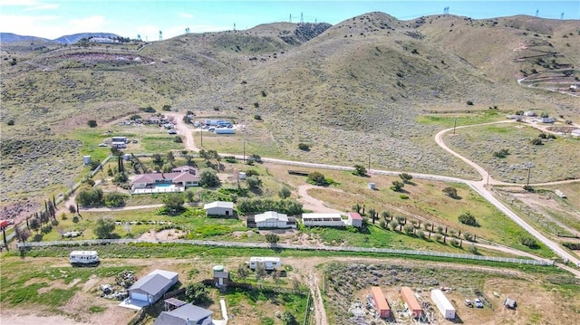 drone / aerial view featuring a mountain view