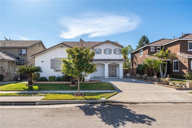 view of front of house with a garage and a front yard