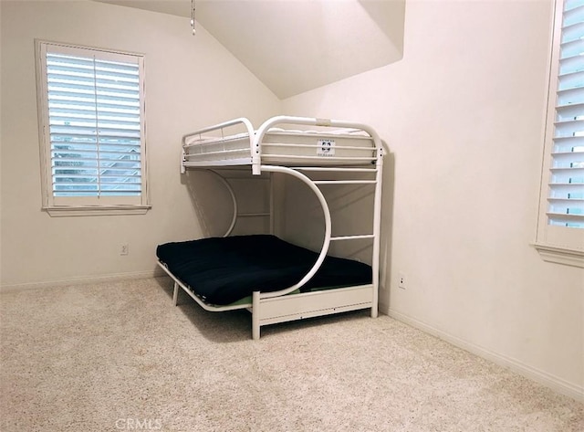 bedroom featuring light carpet and lofted ceiling