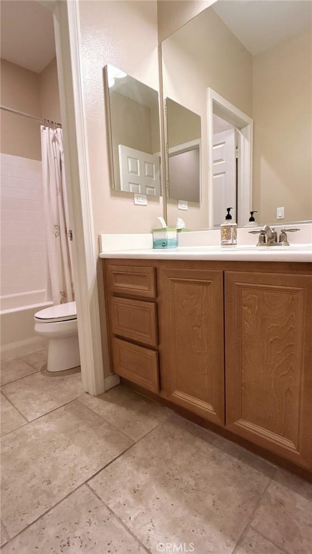 full bathroom with shower / bathtub combination with curtain, vanity, toilet, and tile patterned floors