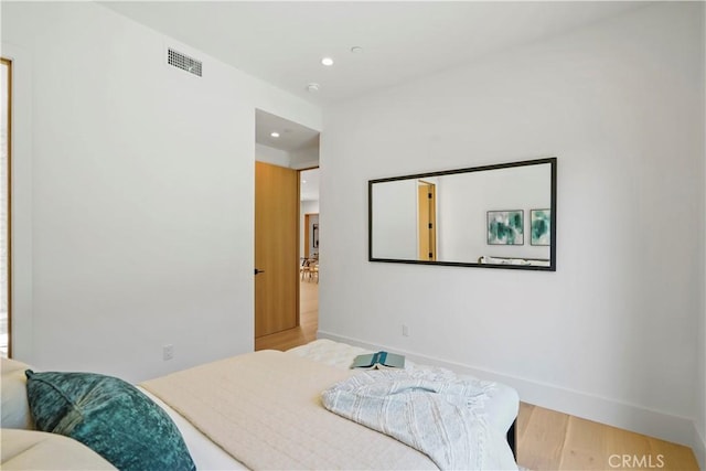 bedroom featuring hardwood / wood-style floors