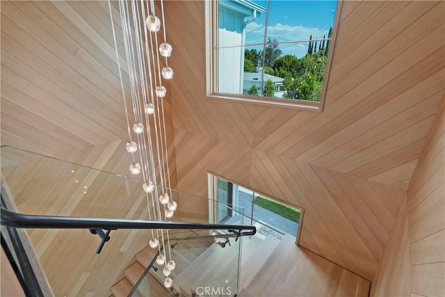 staircase with wooden walls