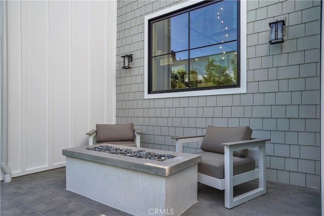 view of patio with a fire pit