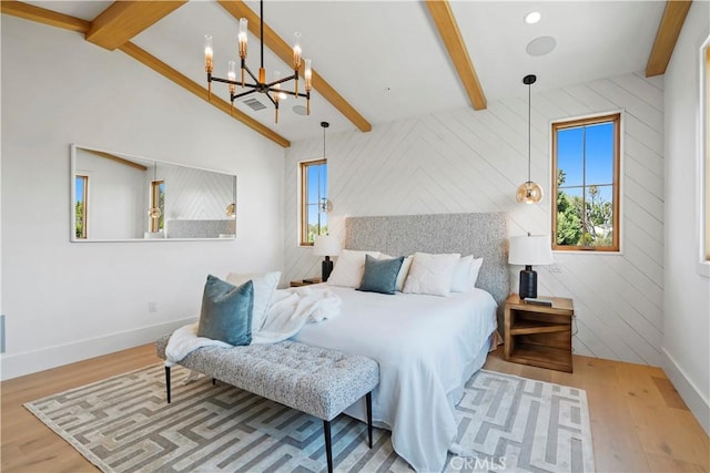 bedroom featuring vaulted ceiling with beams, wooden walls, a notable chandelier, and hardwood / wood-style flooring