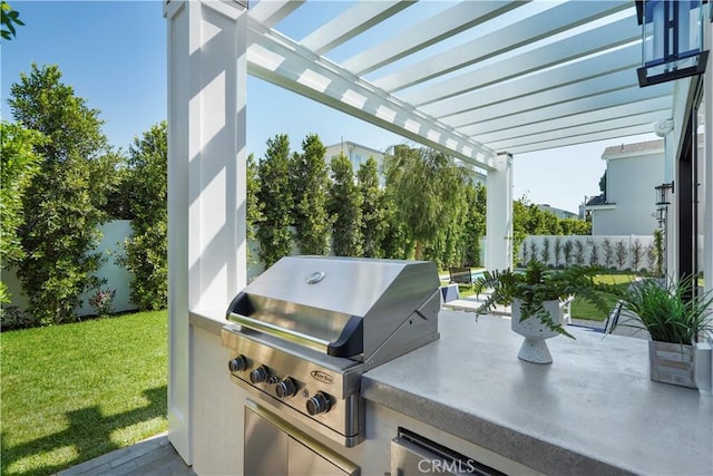 view of patio / terrace featuring an outdoor kitchen, a grill, and a pergola