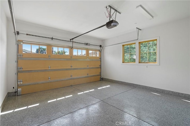 garage featuring a garage door opener