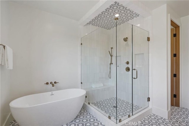 bathroom featuring separate shower and tub