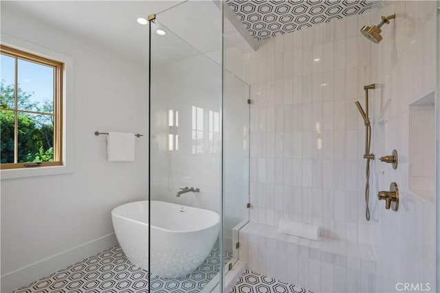 bathroom featuring tile patterned floors and independent shower and bath