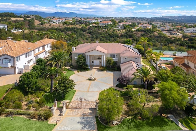 birds eye view of property featuring a mountain view