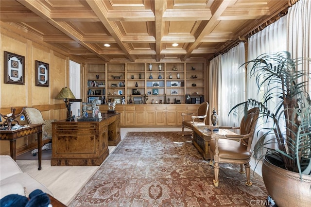 interior space with wood walls, built in features, and coffered ceiling