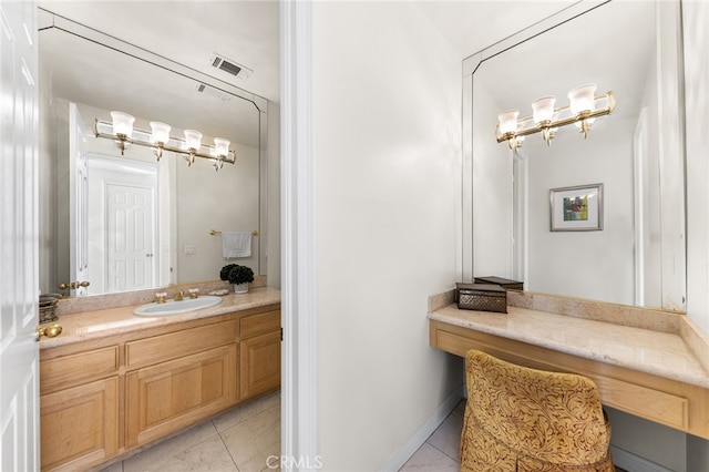 bathroom featuring tile patterned flooring and vanity