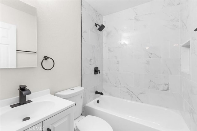 full bathroom featuring vanity, toilet, and tiled shower / bath combo