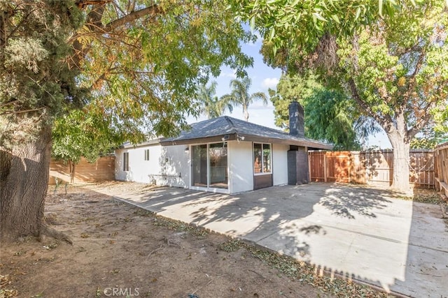 rear view of property with a patio area