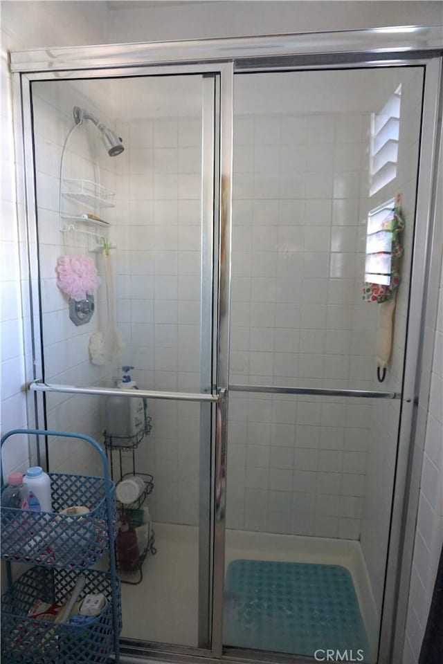 bathroom featuring an enclosed shower