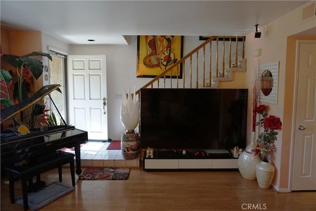 interior space featuring hardwood / wood-style floors and plenty of natural light