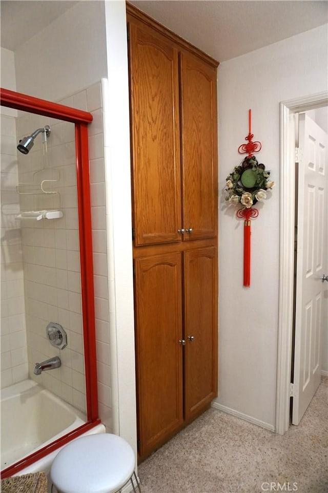 bathroom featuring tiled shower / bath combo