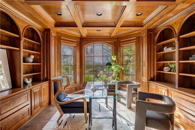 office space featuring wood walls, wooden ceiling, ornamental molding, and coffered ceiling