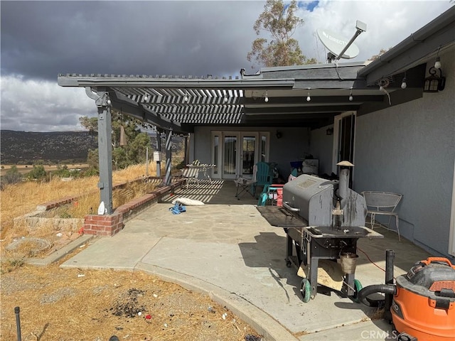 view of patio featuring french doors