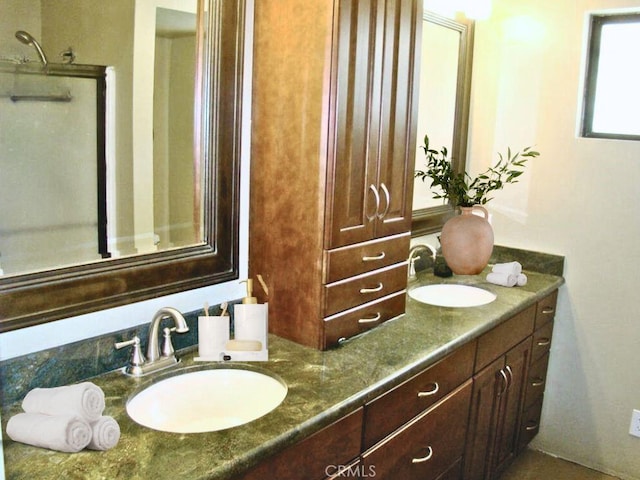 full bathroom with a sink and double vanity