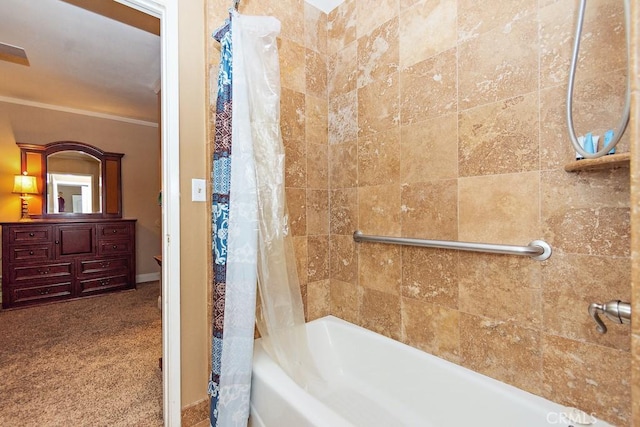 bathroom featuring crown molding and shower / tub combo