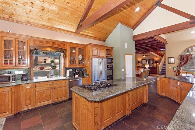 kitchen featuring dark stone counters, black appliances, sink, tasteful backsplash, and wood ceiling