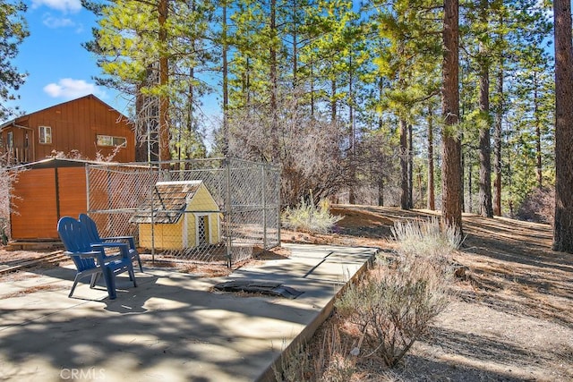 exterior space with a storage unit and a patio area