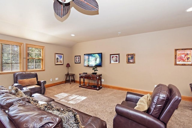 carpeted living room featuring ceiling fan and lofted ceiling