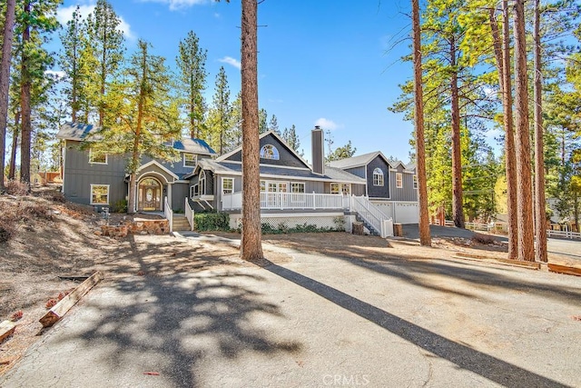 view of front of house featuring a garage and covered porch