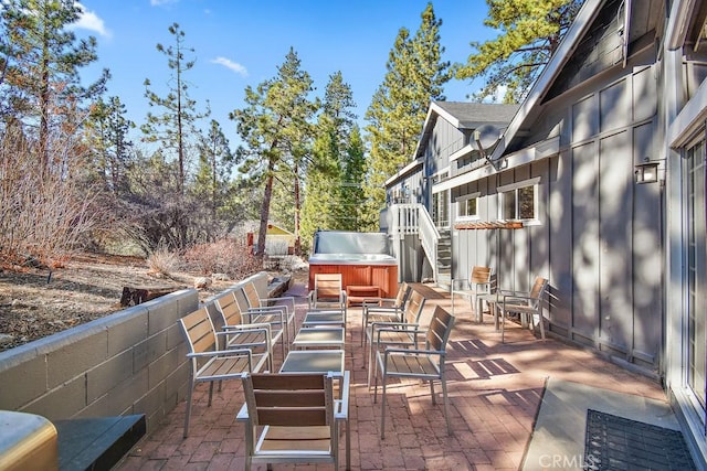 view of patio featuring a hot tub