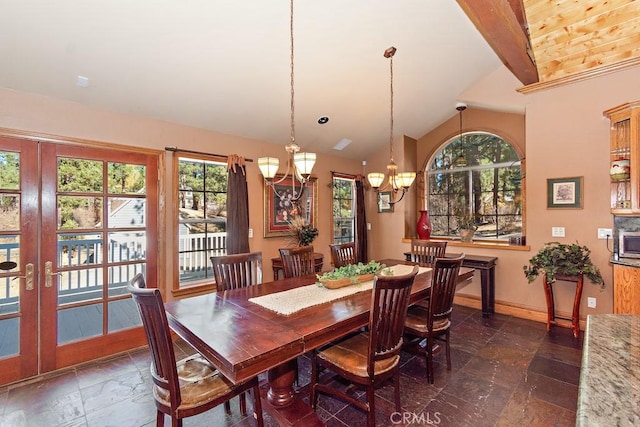 dining area with wooden ceiling, a healthy amount of sunlight, lofted ceiling, and a chandelier