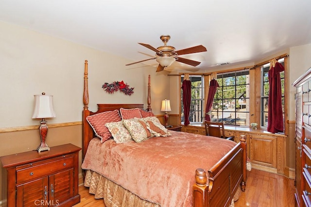 bedroom with ceiling fan and light hardwood / wood-style flooring