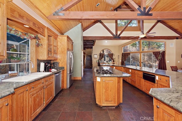 kitchen with a kitchen island, wood ceiling, and stainless steel appliances