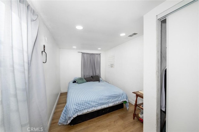 bedroom featuring wood-type flooring