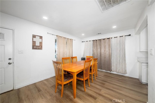 dining space featuring light hardwood / wood-style flooring