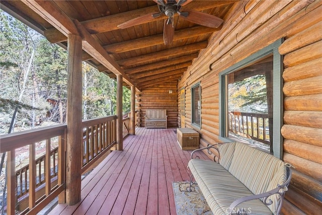 wooden terrace featuring ceiling fan