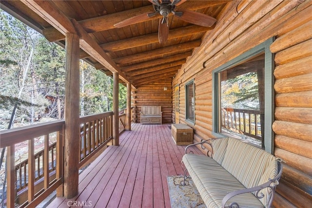 wooden deck with a ceiling fan