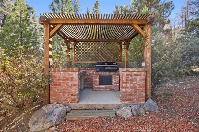 view of patio featuring a pergola, grilling area, and an outdoor kitchen