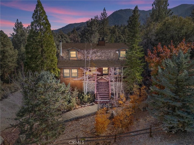 view of front of home with a mountain view