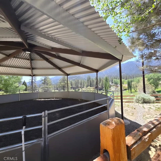 view of horse barn with a mountain view