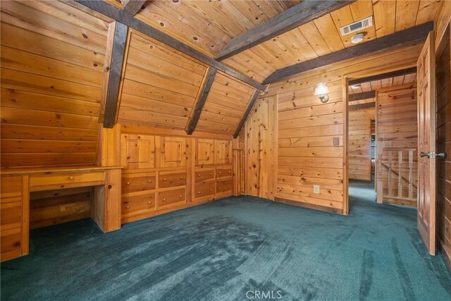 additional living space with wood ceiling, visible vents, carpet floors, wooden walls, and vaulted ceiling with beams