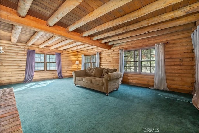 unfurnished room with beamed ceiling, plenty of natural light, wood ceiling, and rustic walls