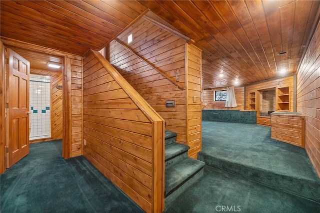 stairs with carpet, wooden walls, and wooden ceiling