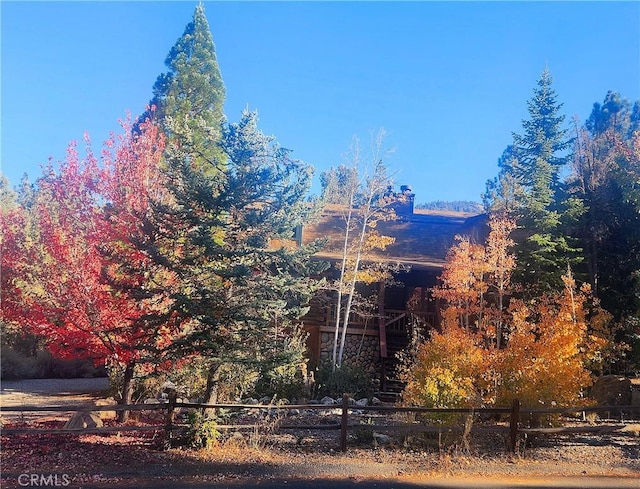 view of side of home with fence