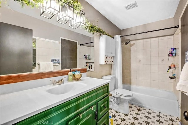 full bathroom featuring shower / bath combination with curtain, toilet, and vanity